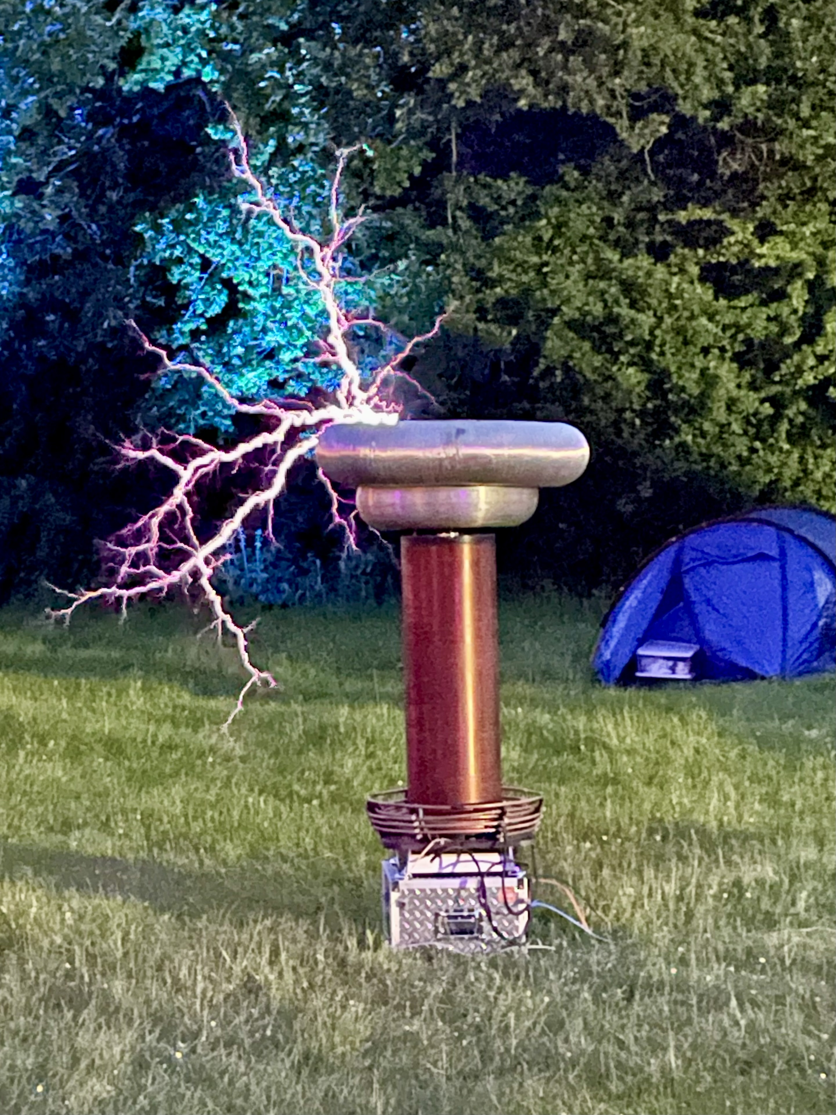 A Tesla coil shooting a bolt of lightning into the air.